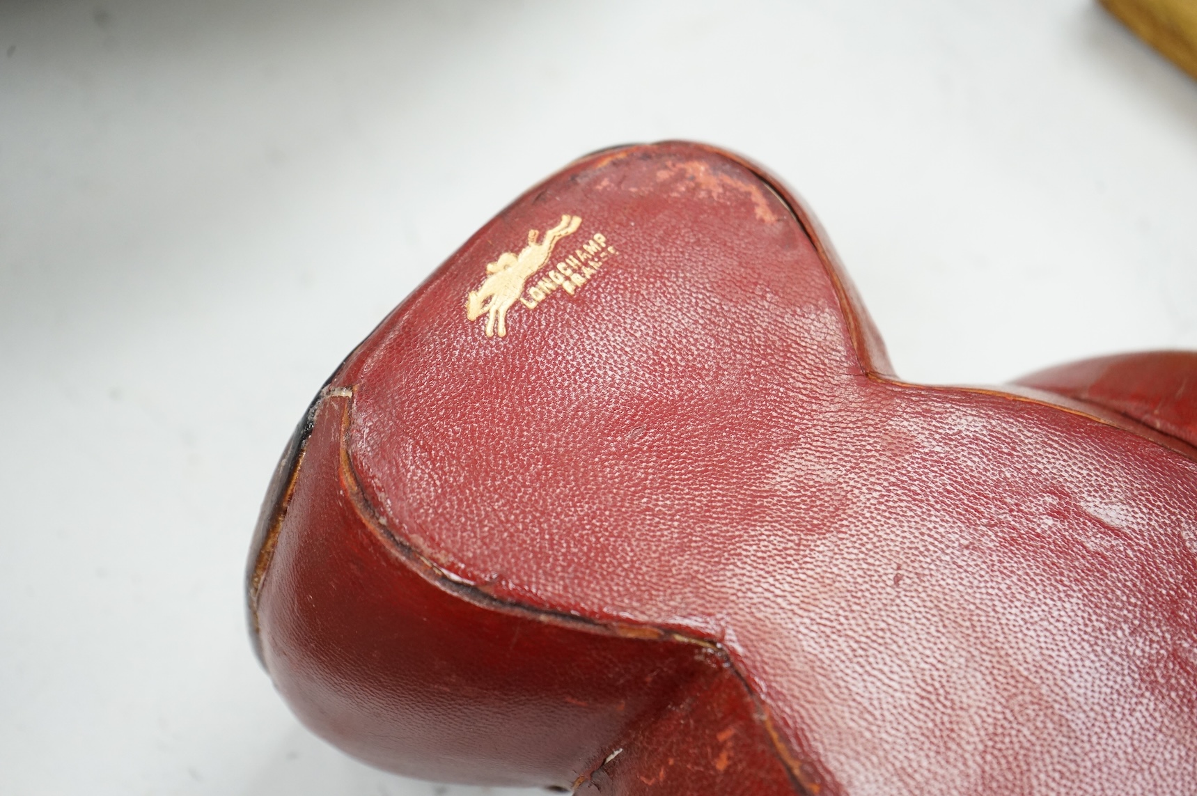A Longchamp leather boxing glove trinket dish, c.1950s, 23cm wide